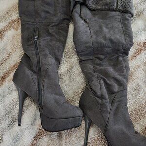 Knee high stiletto heeled boots